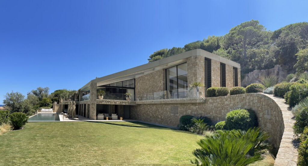 A seamless integration of architecture and landscape, where terraces, garden, and infinity pool extend the living space toward the horizon.